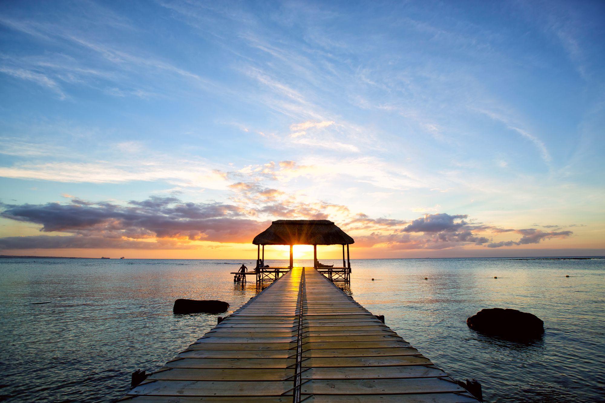 Jetty silhouette against beautiful sunset in Mauritius Island Jetty silhouette against beautiful sunset in Mauritius Island