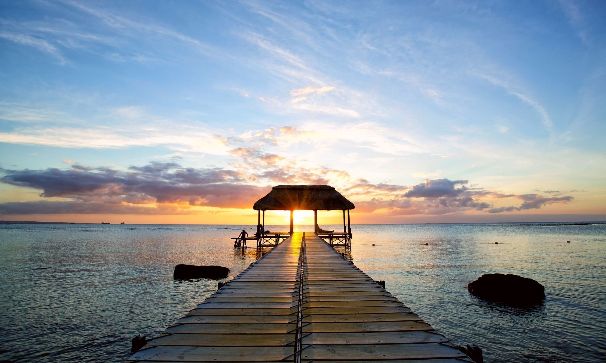 Jetty silhouette against beautiful sunset in Mauritius Island
