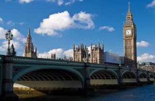 The Big Ben , the Houses of Parliament and Westminster Bridge in London in a beautiful day