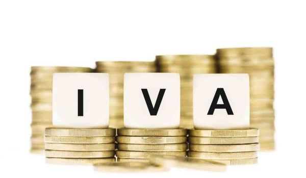 IVA (Value Added Tax) on Piles of Gold Coins with a White Backgr Grindelwald - Suiza
